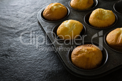 Plain cupcakes on baking tray