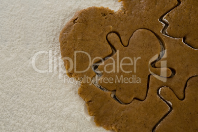 Flattened dough cut with a cookie cutter