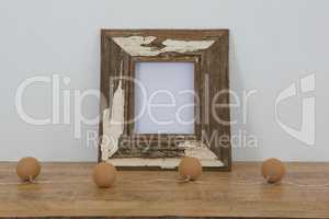 Rustic frame decorated with light on table