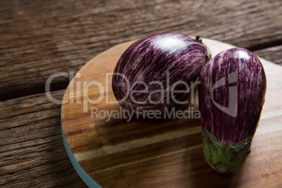 Two eggplant on chopping board