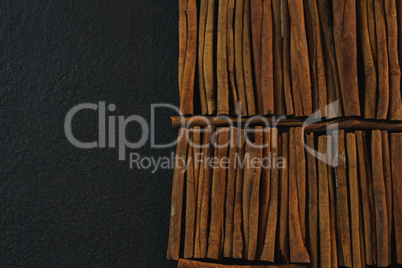 Cinnamon sticks arranged in a row