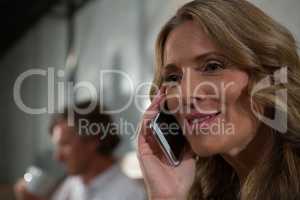 Close-up of woman talking on mobile phone