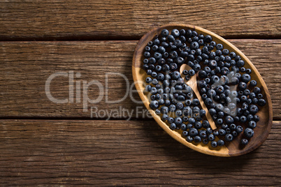 Blueberries in wooden plate