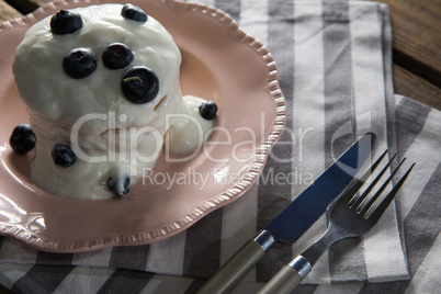 Delicious sweet food in plate with fork and butter knife