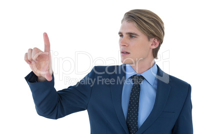 Young businessman wearing suit using invisible imaginary interface