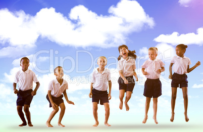 Composite image of happy students in school uniforms