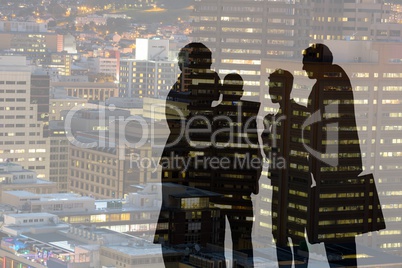 Business people silhouettes against city