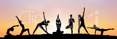 yoga group silhouette at sunset