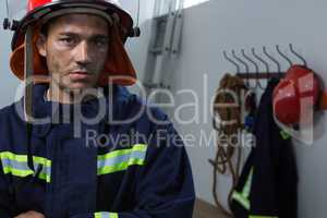 Exhausted fireman standing in the office
