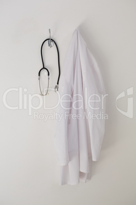 Laboratory coat and stethoscope hanging on hook