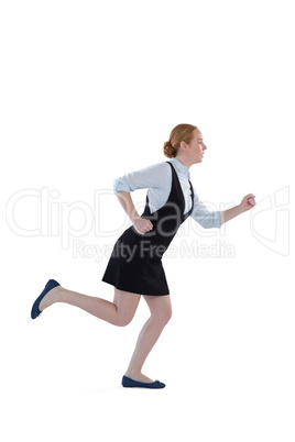 Female executive running against white background