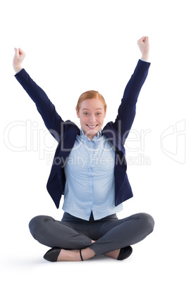 Businesswoman sitting with arms up