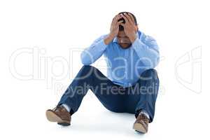 Male executive sitting against white background