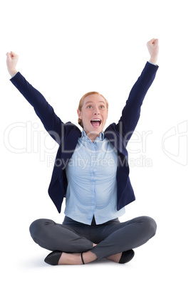 Businesswoman sitting with arms up