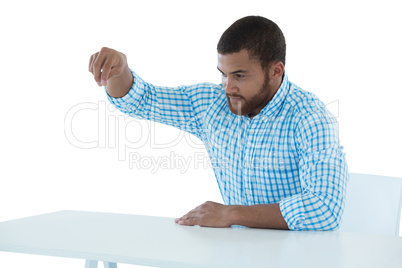 Male executive pretending to hold an invisible object