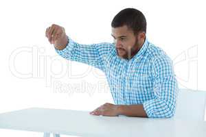 Male executive pretending to hold an invisible object