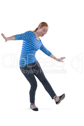 Woman balancing while stepping