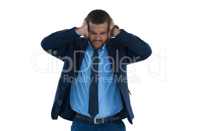 Irritated businessman covering his ears