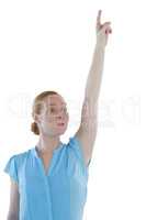 Female executive raising hand against white background