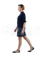 Woman walking against white background