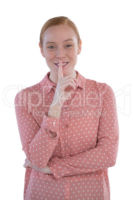 Beautiful woman with finger on lips Beautiful woman with finger on lips