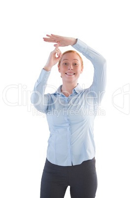 Businesswoman showing time out hand sign