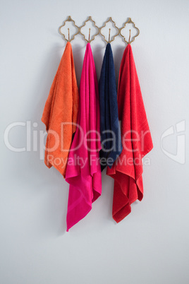 Colorful towels hanging on hook