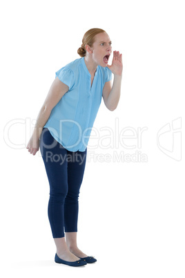 Female executive shouting against white background