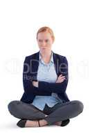 Upset businesswoman sitting with arms crossed