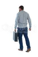 Male executive walking with briefcase