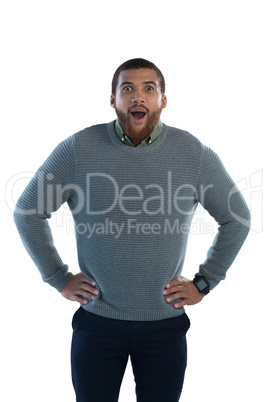 Man standing with hand on hips against white background
