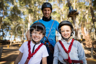 Kids and instructor standing together in park