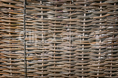 The fragment is woven from the branches of the fence. Reference picture.