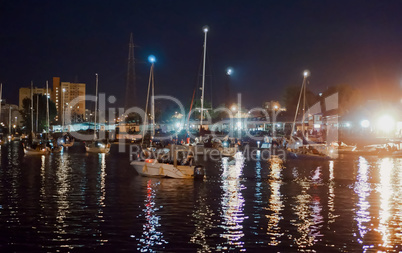 bridge swing night, boats pass along the river at night