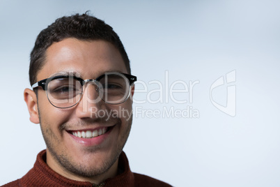 Man in spectacles smiling at the camera