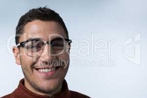 Man in spectacles smiling at the camera