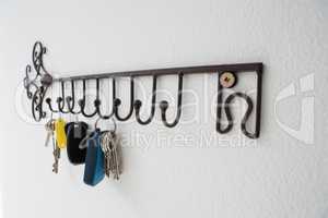 Close-up of various keys hanging on hook