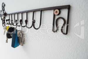 Close-up of various keys hanging on hook