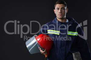 Fireman holding a safety helmet