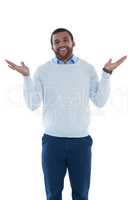 Male executive gesturing against white background