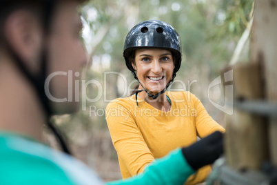 Woman enjoying zip line adventure in park