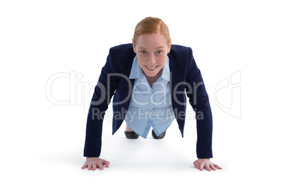 Businesswoman performing push ups