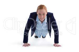 Businesswoman performing push ups