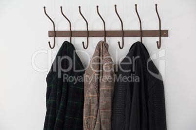 Close-up of warm clothes hanging on hook