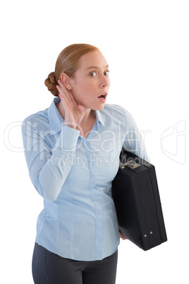 Businesswoman with a briefcase listening to the gossip