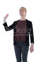 Female executive gesturing against white background