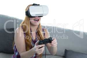 Woman playing video game with virtual reality headset