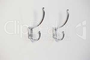 Empty hooks attached on wall