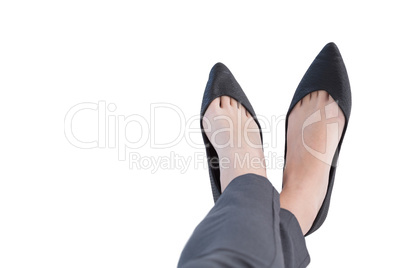 Female executives legs crossed at ankle