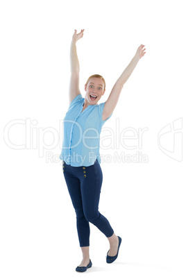 Female executive standing with arms up against white background